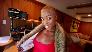 Bald-haired Ebony lady seductively displays her XXX assets on the camera