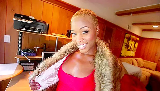 Bald-haired Ebony lady seductively displays her XXX assets on the camera