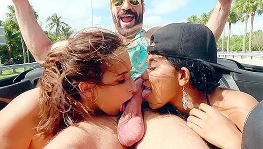 Bearded porn macho enjoys XXX sucking by two bitches in moving convertible